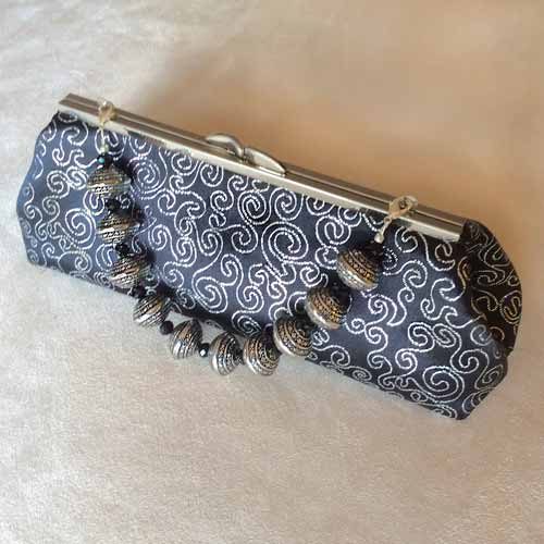 Aztec black silver swirl bracelet clutch